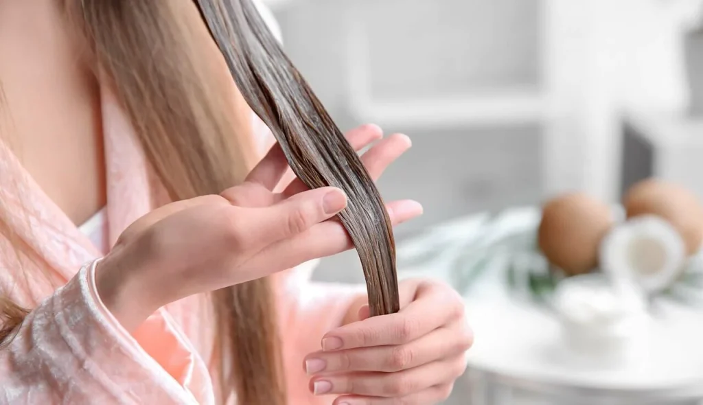 large main woman applying hair mask